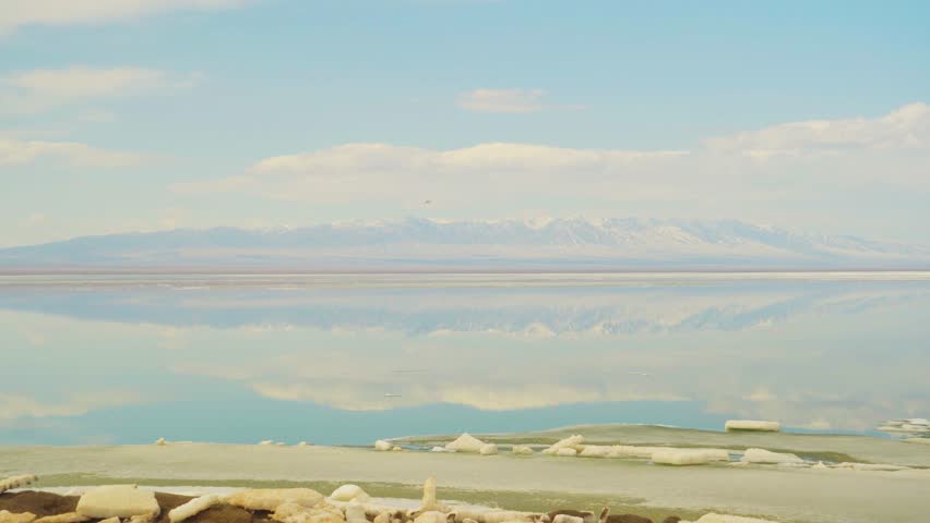 Peaceful Mountain Scene. Serene Landscape With Clear Lakes And Towering Mountain Vistas. Tranquil Alpine Environment Showcasing Reflective Lakes And Rugged Mountain Formations Under Bright Sky