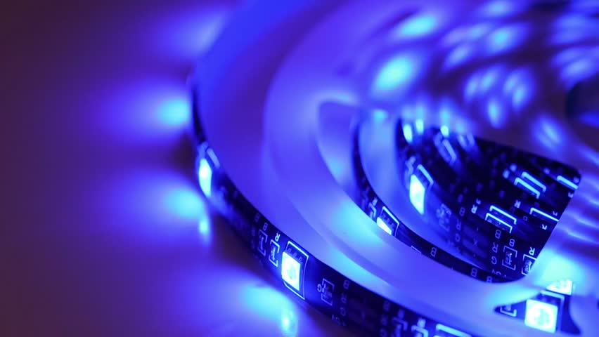 Color changing LED strip light glowing in dark background