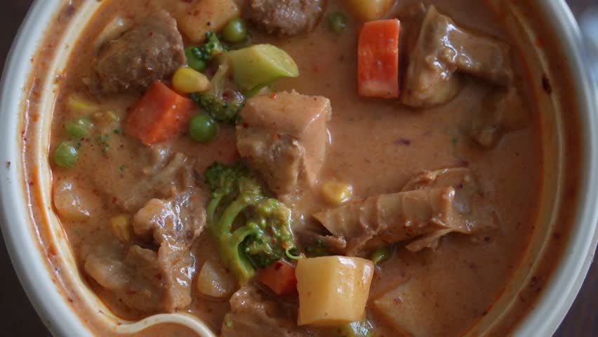 Top view of curry with beef, green beans and potatoes, Thai food