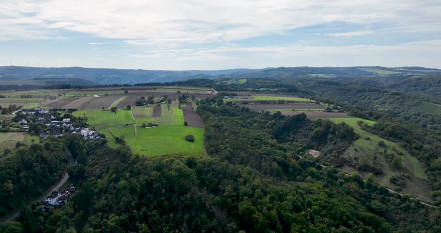 Aerial view of the Golfclub Jakobsberg, showcasing the verdant fairways and surrounding landscape, a blend of cultivated greens and natural woodlands, Braubach, Germany.