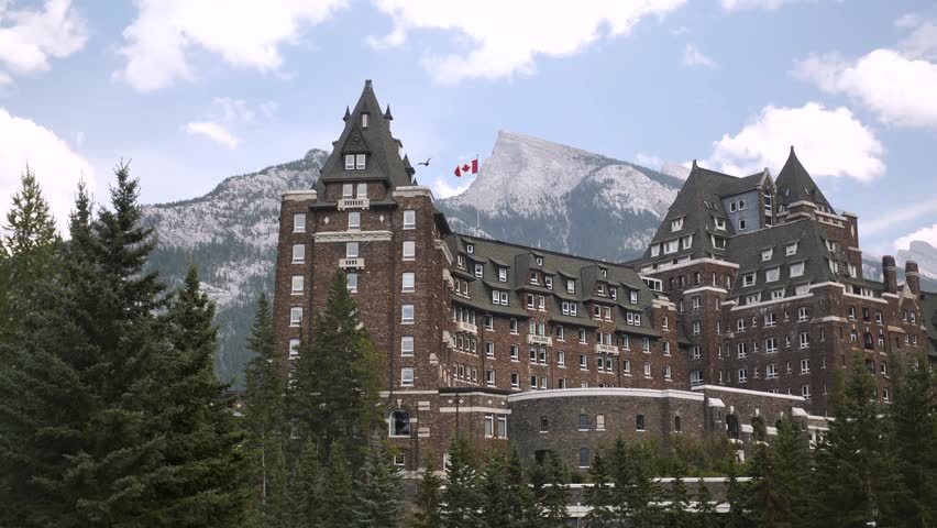 Luxury Historic Fairmont Banff Springs Hotel with majestic Mount Ruddle in the background, Banff National Park, Alberta, Canada. Road trip in Canada. Rocky mountains. 