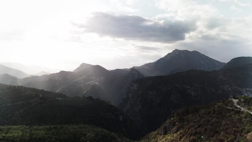 A mountain range with clouds.