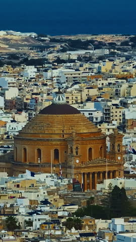  Aerial view of Mosta Church, famous remarkable wartime miracle, architectural landmarks, Malta 