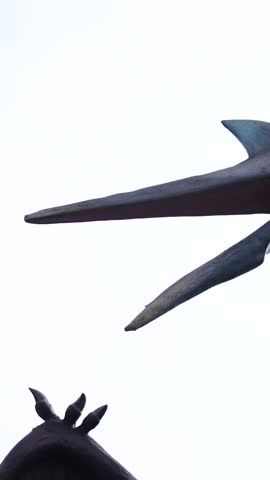 A Pterodactyl Roaring over Overcast Ancient Sky - Vertical