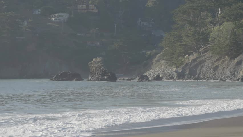Beach with cliff middle ground and hill background, San Francisco