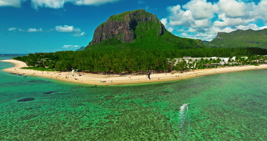 Aerial view of Le Morne beach in Mauritius, Le Morne Brabant mountain and luxury beachfront resort in the foreground