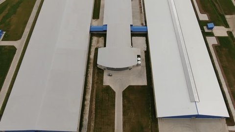 Aerial Descent Upward Tilt above Farm Complex