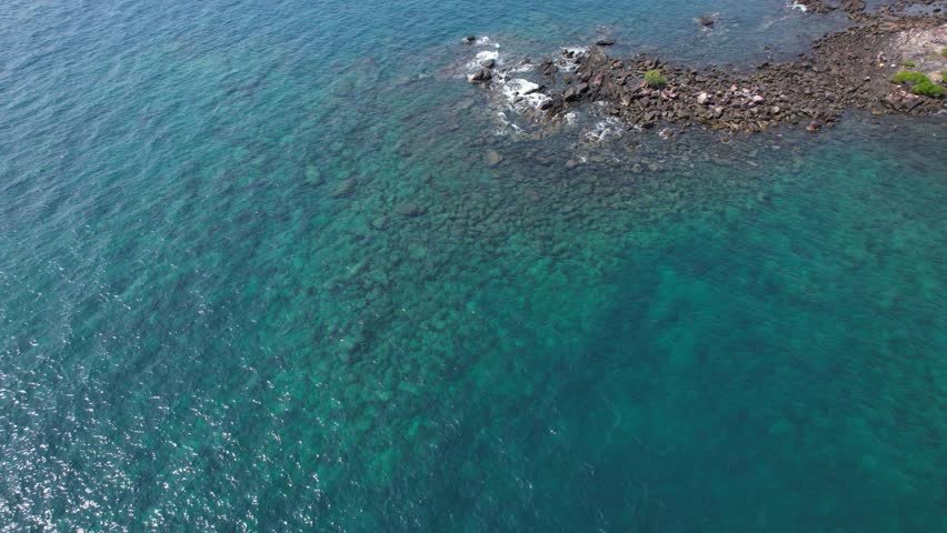 Rocky Shoreline With Craggy Stones Near Khlong Han Beach On Koh Kood Island, Thailand. aerial shot