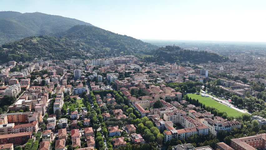 Aerial view of Brescia Italy - old world architecture mixed with modern city living on a summer day
