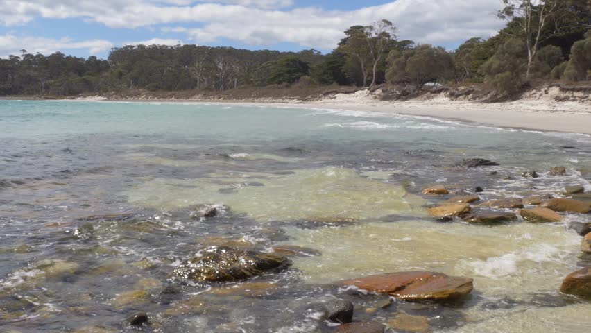 Calm Waves On The Rocky Shores Of Maria Island In Tasmania, Australia. Static Shot