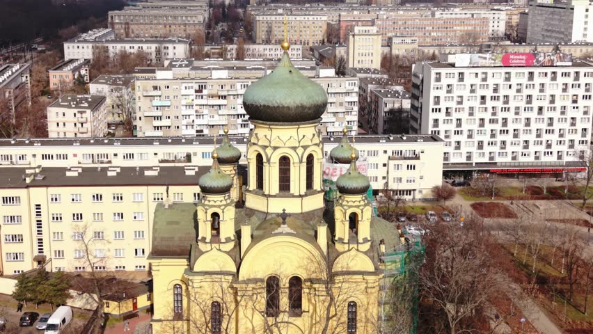 Wide Panorama Warsaw Neighborhood Church Travel Blogger Framing Yellow Domes Against Apartment Blocks, Tram Routes And Community Spaces, Distant Skyline And Inviting Urban Composition