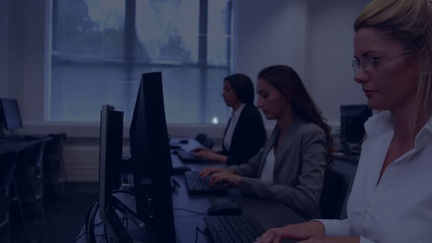Front woman, team typing for training, ring appearing causing network nodes linking across monitors. Office, colleagues, screens, visualization, overlay, connectivity, learning