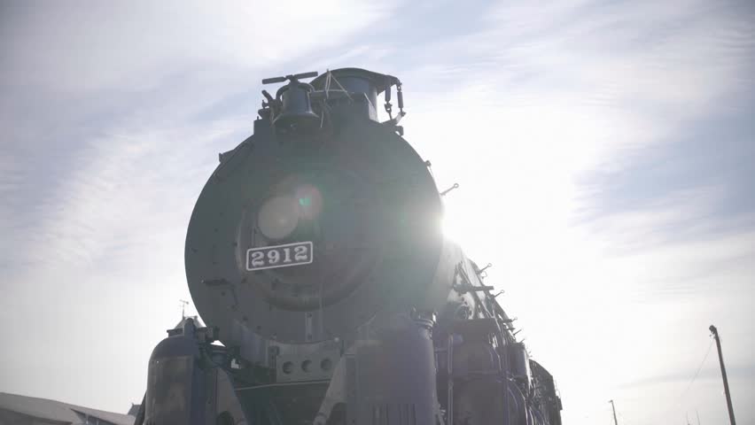 Silhouette of Santa Fe 2912 Steam Locomotive with Sun Flare in Pueblo Colorado USA