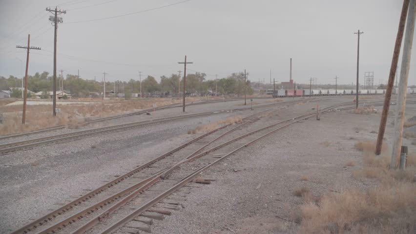 Railroad Tracks Converging in Wide Industrial Rail Yard