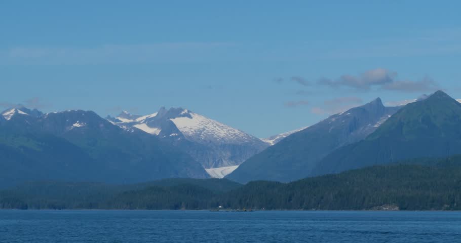 Sunny day in Juneau, Alaska.Mendenhall Glacier and the surrounding mountains in the background.