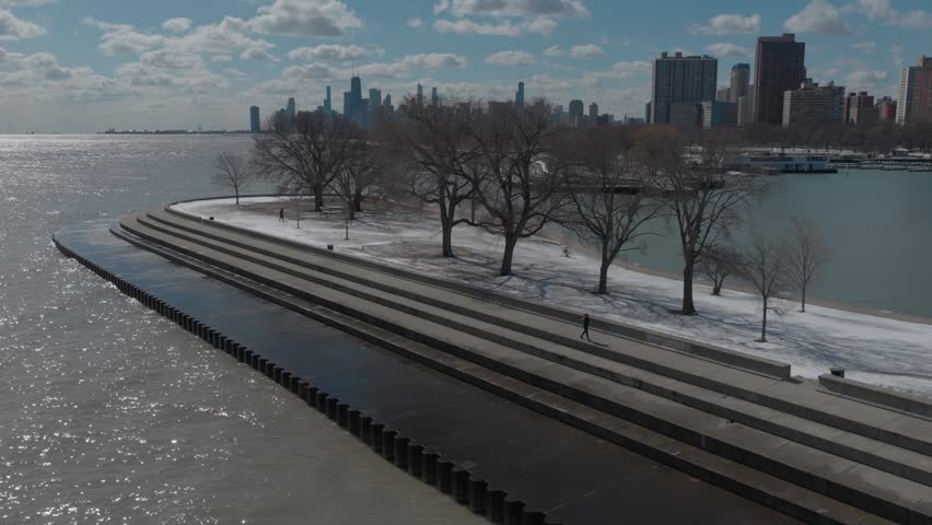 A moving shot of Downtown Chicago and Montrose Harbor along Lake Michigan in the Winter.