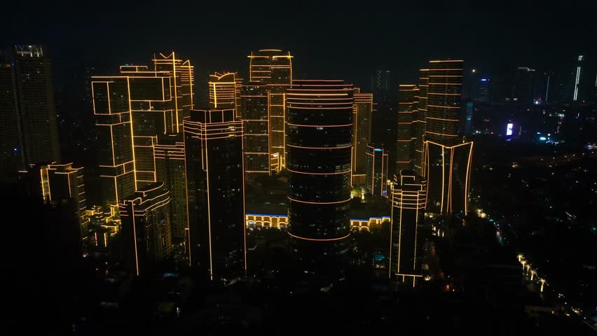 City skyline at night with illuminated skyscrapers in Makati Metro Manila