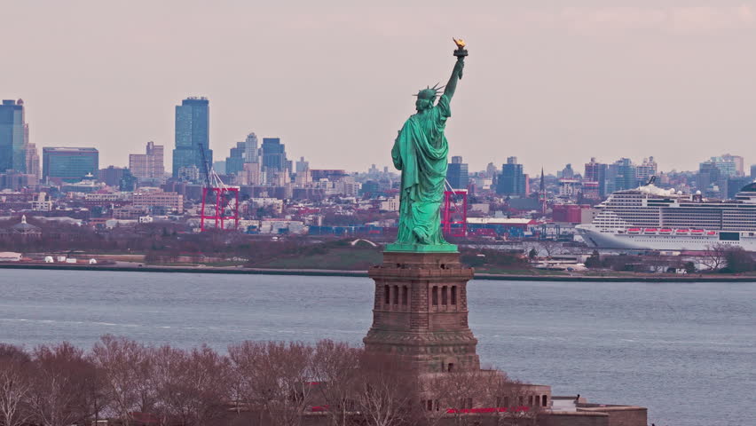 Liberty monument. New York City skyline. Liberty statue with NYC skyline. New York City banner with Liberty monument. Liberty statue and New York City skyscrapers.
