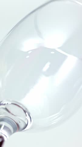 White wine pouring into glass with detailed bubbles in macro view. Concept of premium beverage, wine tasting, luxury drink, restaurant menu presentation and elegant alcohol branding.