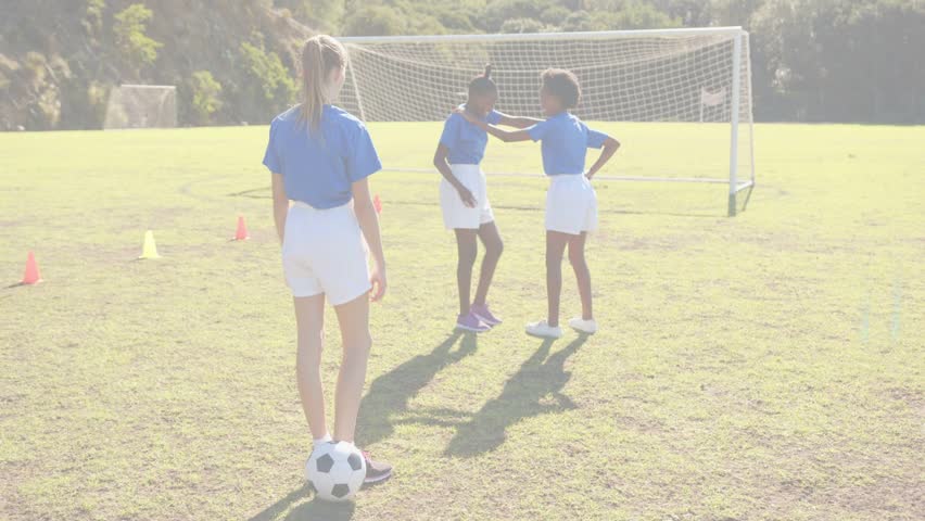 Three girls placing hand then starting passing drill during training, ball, UI overlays shifting. Soccer, teamwork, youth, outdoor, field, goal, cones