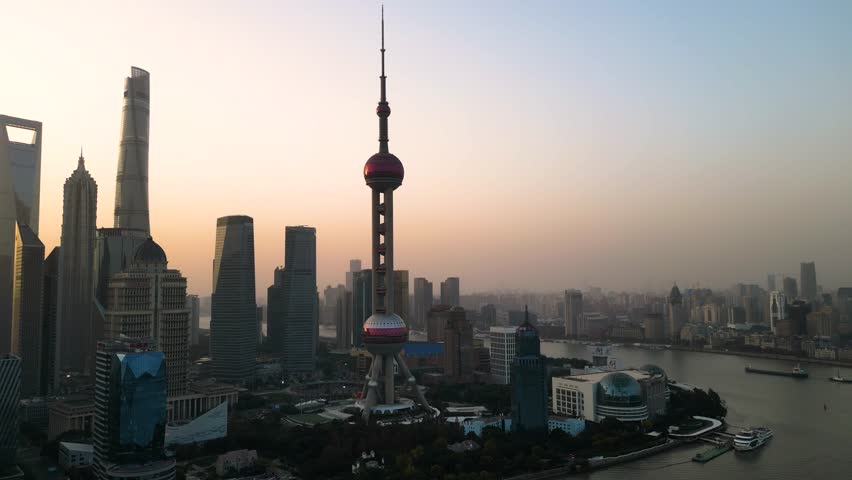 he skyscraper of Oriental Pearl TV Tower in Pudong landmarks is a district of Shanghai, China, located east of the Huangpu River across from the historic city.