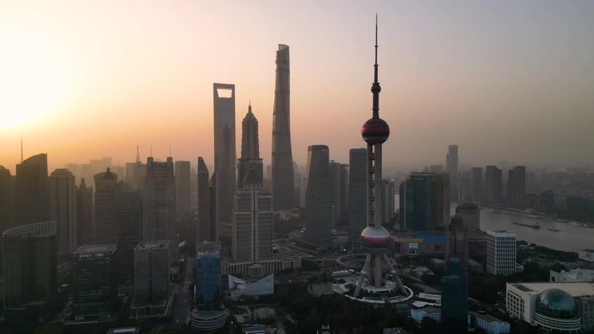 he skyscraper of Oriental Pearl TV Tower in Pudong landmarks is a district of Shanghai, China, located east of the Huangpu River across from the historic city.