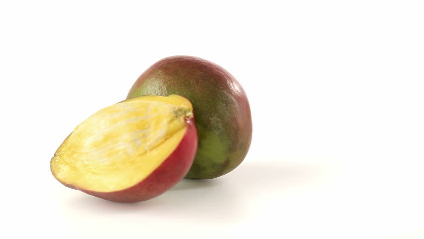 Mango cut in half and slices