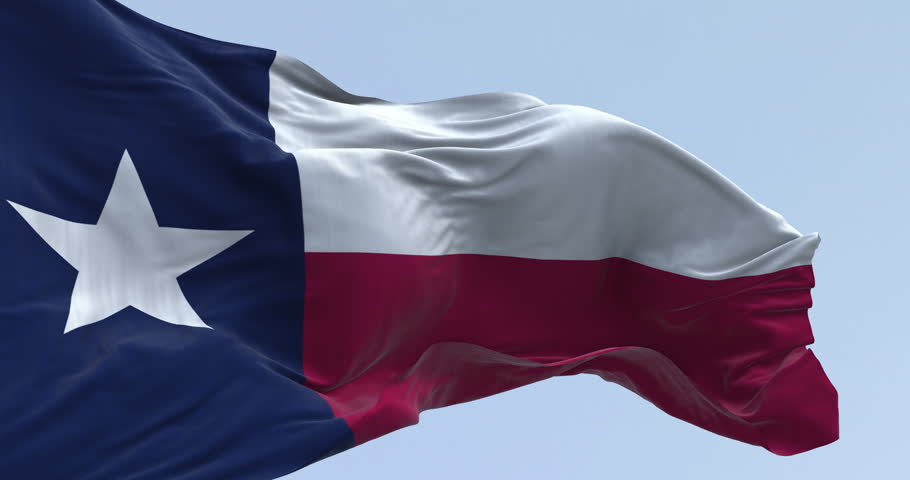 Close-up of Texas state flag waving in the wind. Blue vertical stripe with white star, white and red horizontal stripes. Seamless 3d render animation. Slow motion loop. Selective focus