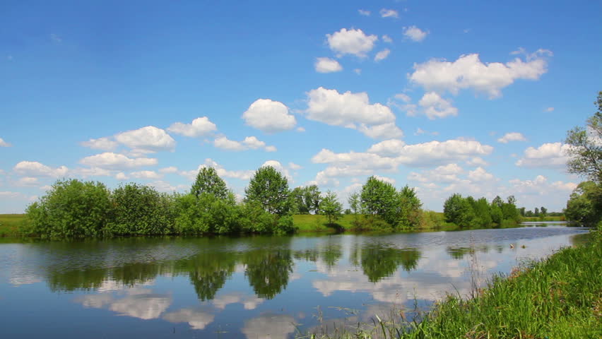 landscape with clouds over lake