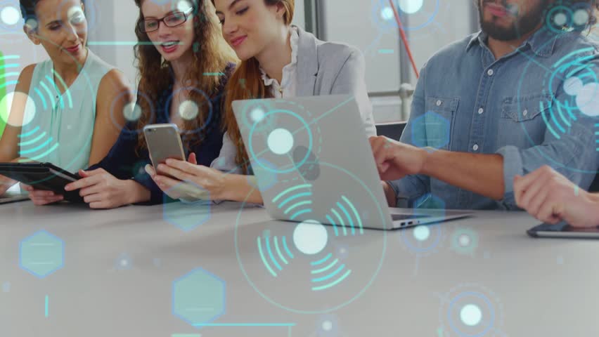 Center woman showing phone, man tapping laptop, tech team working on tablet with HUD showing data. Collaboration, office, conference, displays, technology, modern, productivity