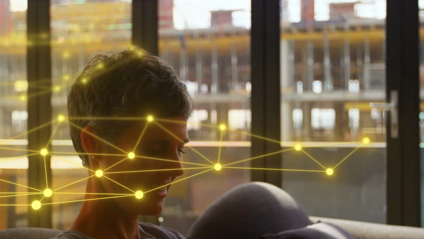 Woman using phone, tapping, scrolling while golden network drifting, checking tech data. Mature, livingroom, smartphone, overlay, augmented, backlight, focus