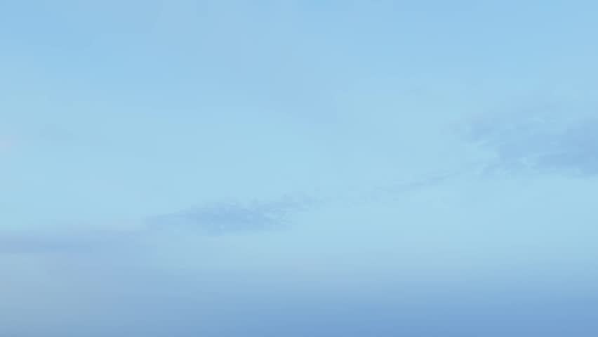 Revealing aerial of Istanbul metropolis skyline with modern skyscrapers and busy highway traffic transitioning from day to twilight showing city