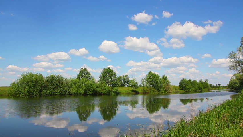 timelapse landscape with clouds over lake