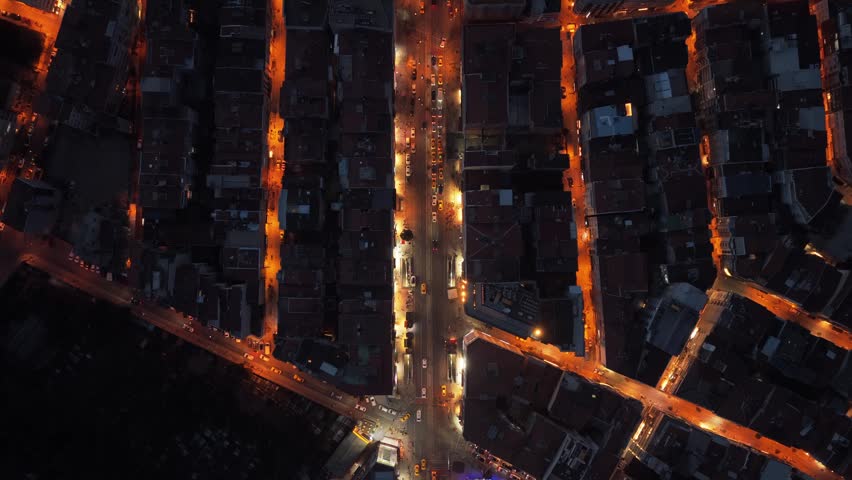Downtown urban Istanbul metropolis with illuminated street network, night life, moving traffic, building rooftop and architecture, aerial high angle from above