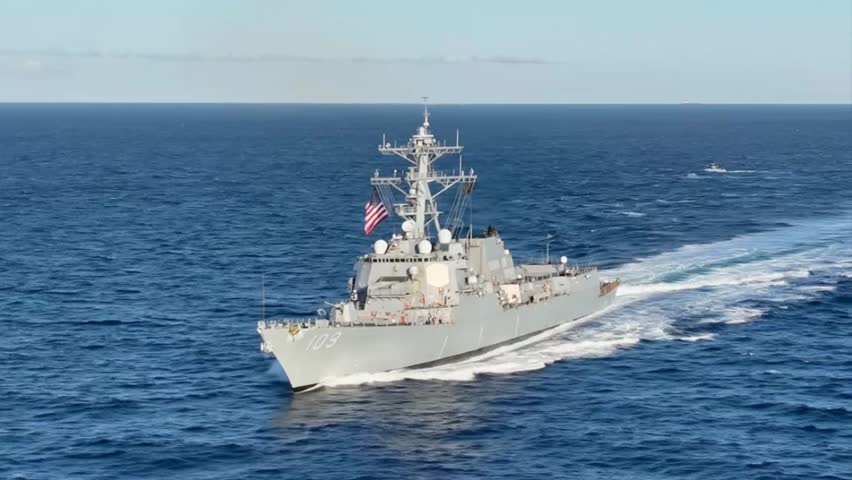 Modern Warship Sailing Calmly Under Clear Blue Sky