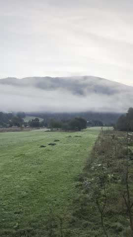 foggy mountains seen from window view in morning light