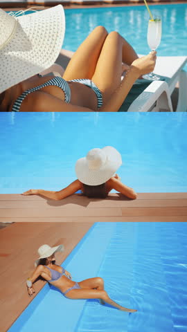 Young woman in striped bikini and sun hat relaxing by swimming pool with cocktail. Beautiful female enjoying luxury summer vacation in sun