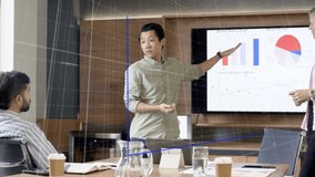 Co-presenters gesturing, causing 3D bars expanding while pointing pie, explaining business trends. Boardroom, presentation, dashboards, data, holographic, visualization, teamwork - Powered by Shutterstock - Get 15% off with code: PIKWIZARD15
