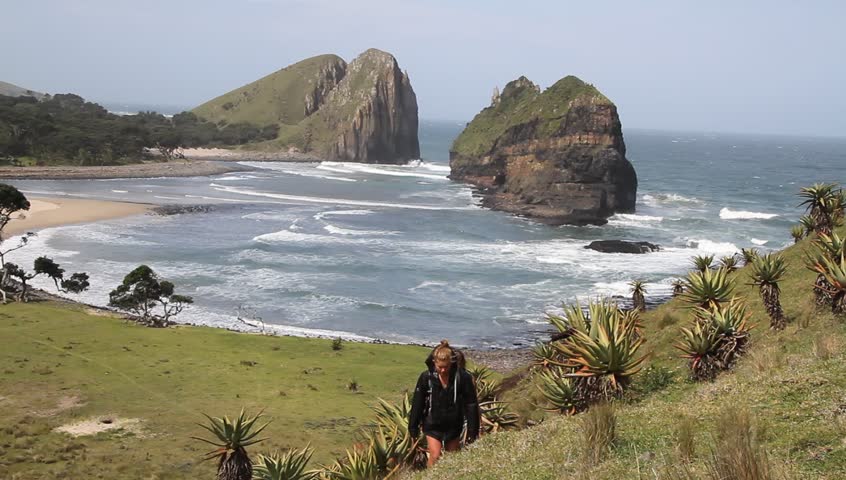 Two girls walking up a hill at the Transkei , Hole in the Wall is in the
