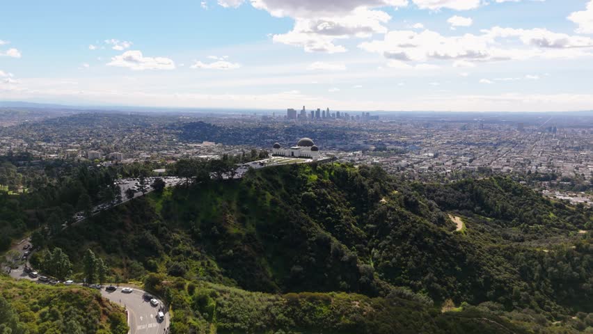 Griffith Observatory aerial view with Los Angeles skyline cinematic cityscape California USA