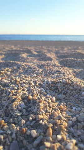 Pebbles and sand on a sunny beach