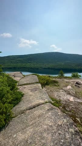 Walking Across Granite Toward a Lakeside Vista (Acadia National Park, Maine, USA)