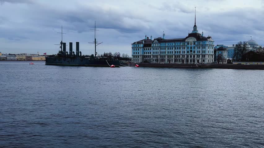 St. PETERSBURG, RUSSIA - April 20, 2024: The Aurora Cruiser Museum on the Neva River on a 20th-century warship. View of the cruiser Aurora, a historical warship, now a war memorial museum. 4К