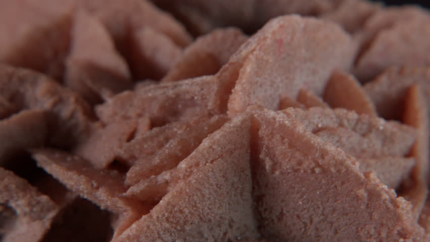 A macro of desert rose crystal or sand rose (a rose-like formations of crystal clusters of gypsum and sand grains)� isolated on a black background