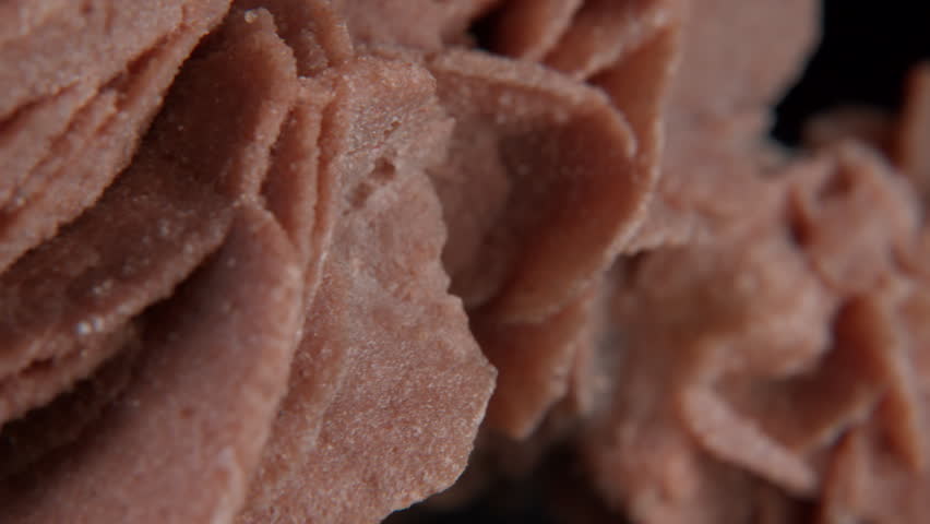 A macro of desert rose crystal or sand rose (a rose-like formations of crystal clusters of gypsum and sand grains)� isolated on a black background