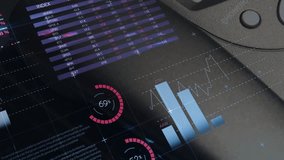 Panel reacting to finger passing and animating bar charts and gauges under reflection for meeting. Data, visualization, dashboard, analytics, metrics, touchscreen, device - Powered by Shutterstock - Get 15% off with code: PIKWIZARD15