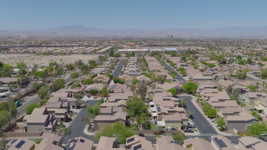 Las Vegas Desert Suburb With Stucco Homes And Distant Mountains