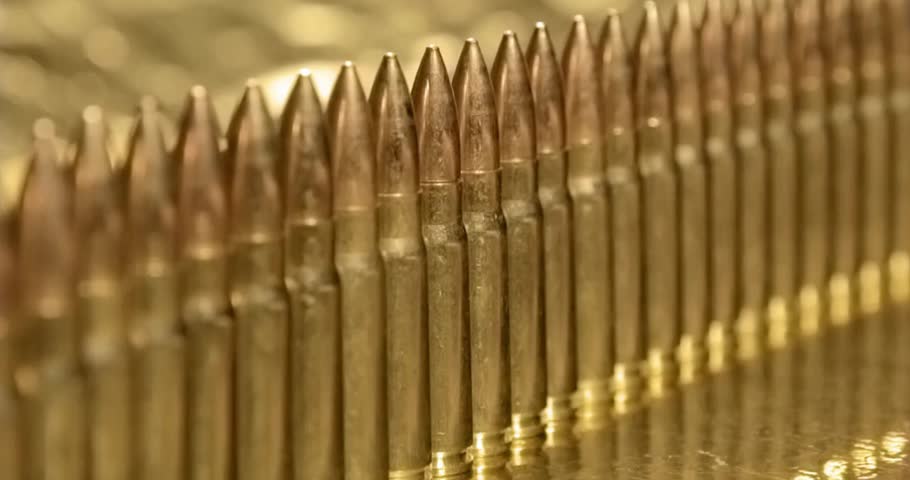 Closeup Bullets Mass Production Concept Bullet in a row. Group of ammo gun riffle glock machine guns cinematic