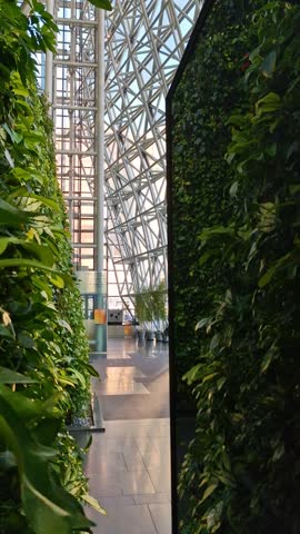 Vertical View of Seoul City Hall Interior, Green Wall and External Glass Wall With Mirror, South Korea