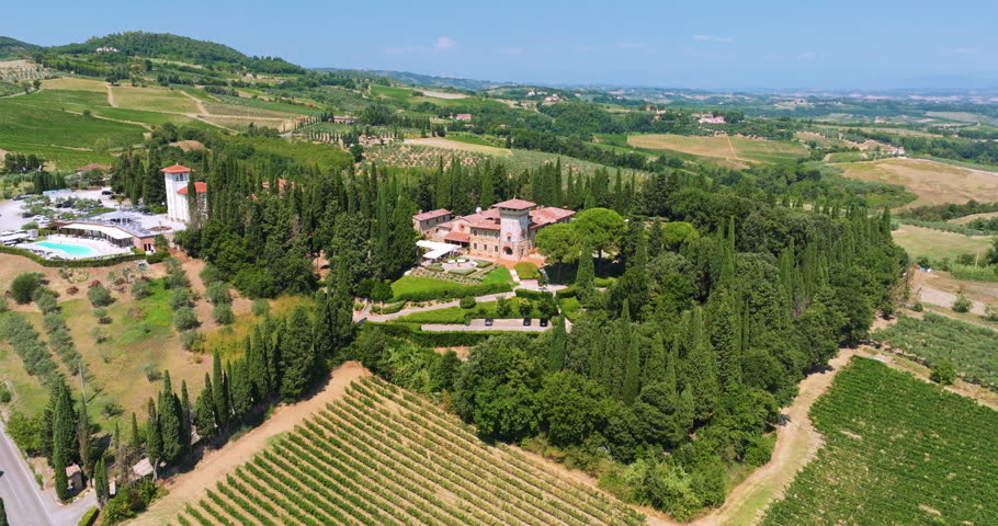 Skyline drone view Italy agricultural land. Vineyards luxury villas green landscape background sunny weather. Italian travel landmark scenic rural landscape exploration destination high angle.